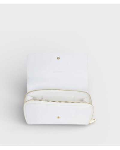 Interior cartera Valentino Bags blanca con compartimentos y cremallera dorada