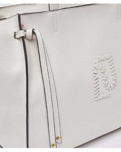 Detail of Liu Jo embroidered logo and decorative cord with gold studs on white tote