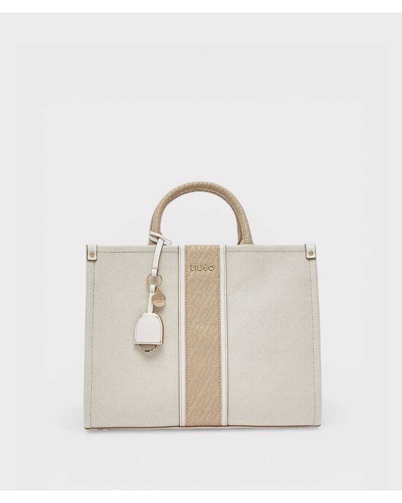 Liu Jo bolso tote beige Ridhi vista frontal con franja jacquard y charm dorado Liu Jo bolso tote beige Ridhi vista frontal con franja jacquard y charm dorado