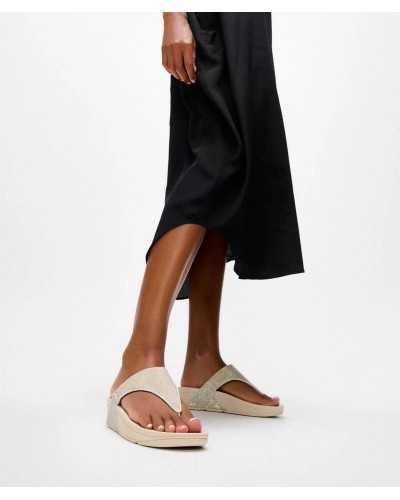 FitFlop Lulu Shimmerglitz gold shimmer sandal worn with black dress lifestyle